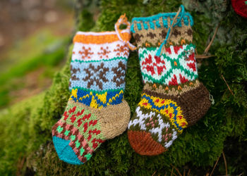 Knitted socks on a natural earth background, handicraft concept, knitting as a hobby, handicrafts