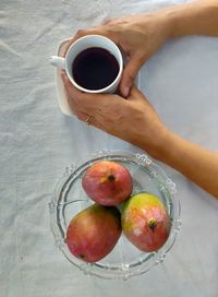 High angle view of woman holding coffee