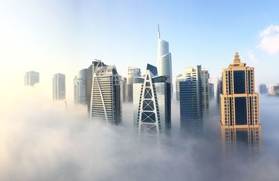 Modern buildings against sky in city