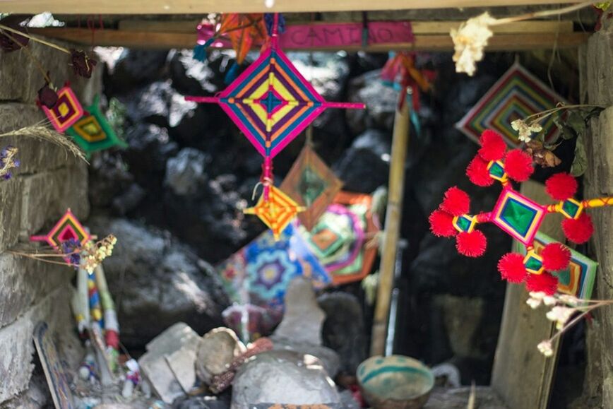 hanging, focus on foreground, religion, close-up, decoration, multi colored, selective focus, cultures, tradition, red, day, flower, spirituality, flag, padlock, text, celebration, no people, outdoors, abundance