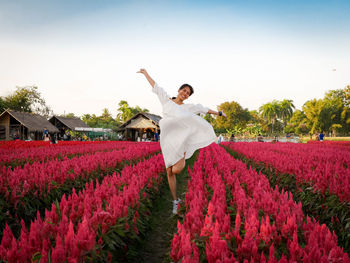 Full length of woman standing on field