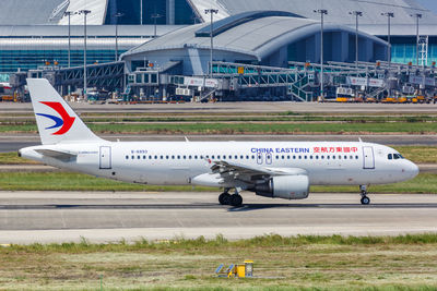 View of airplane at airport runway