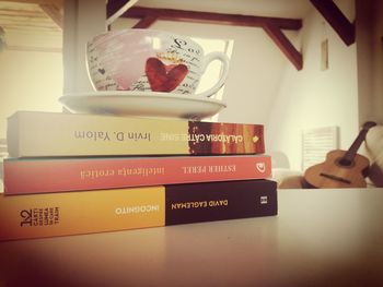 Close-up of books on shelf at home