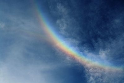 Low angle view of rainbow against sky