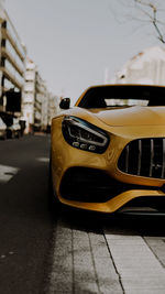 Close-up of car on road