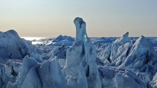 Panoramic view of snowcapped mountains against sky