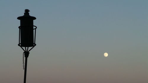 Low angle view of street light against sky