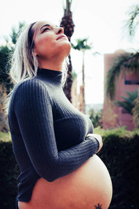 Pregnant woman looking up