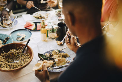 Group of people eating food in restaurant