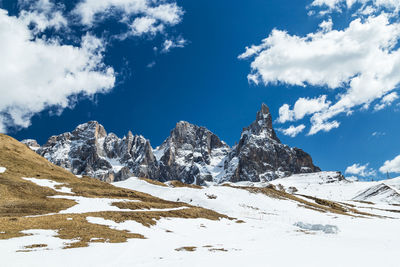 Scenic view of snowcapped mountains against sky. pale di san martino. passo rolle. dolomites. italy