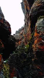 Low angle view of rock formation against sky