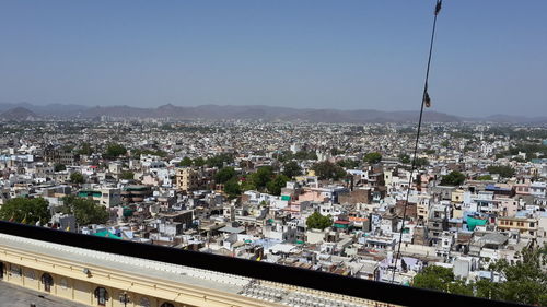 High angle view of buildings in city against clear sky