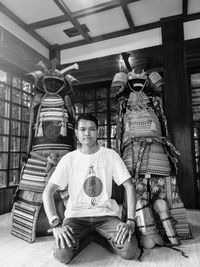 Portrait of young man sitting in temple