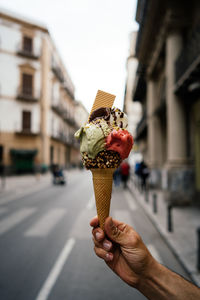 Hand holding ice cream cone