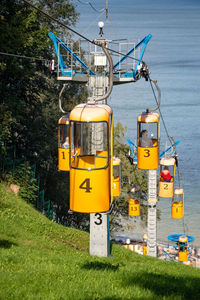 Yellow cable car on field