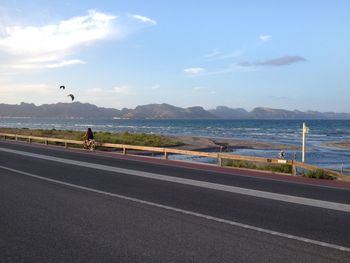 Scenic view of sea against cloudy sky