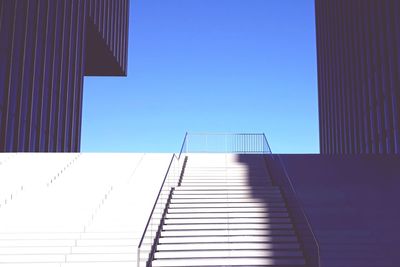 Low angle view of modern building against clear blue sky