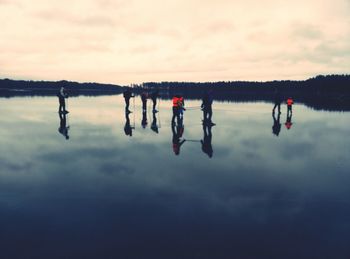 Scenic view of lake against cloudy sky