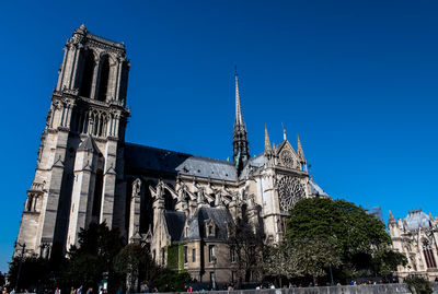 Low angle view of building against blue sky