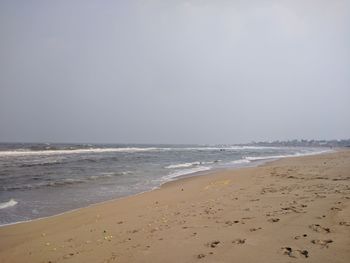 Scenic view of beach against clear sky