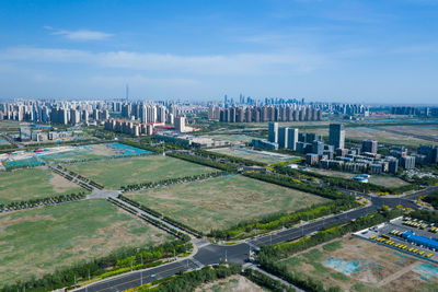 Aerial view of city buildings against sky