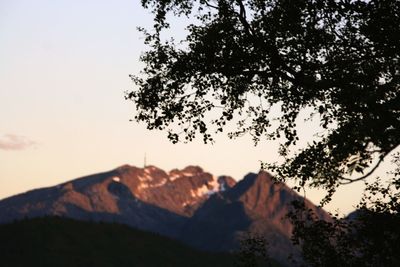 Scenic view of mountains against sky at sunset
