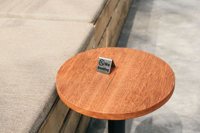 High angle view of text on wooden table