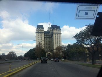 Road in city against sky