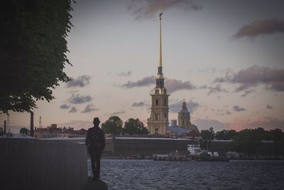 People in water at sunset