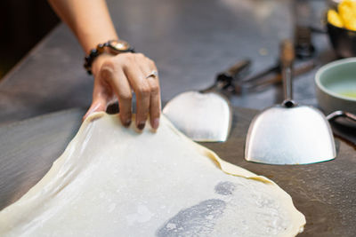 Close-up of woman hand on table