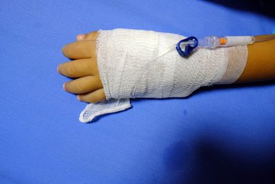 Cropped hand of woman with iv drip
