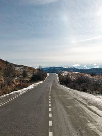 Empty road along landscape