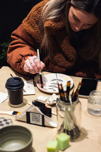 Woman preparing food at table