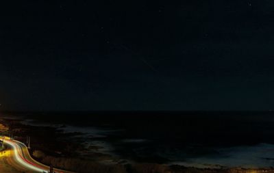 Scenic view of sea against sky at night