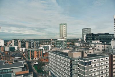 Modern buildings in city against sky