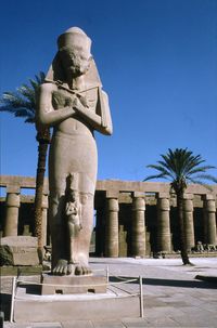 Low angle view of statue against clear blue sky