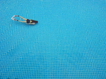 High angle view of woman swimming in pool