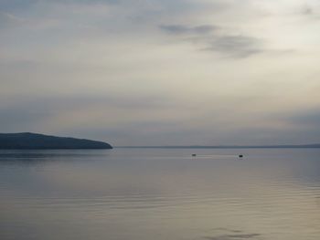 Scenic view of seascape against cloudy sky