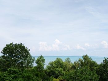 Scenic view of sea against cloudy sky