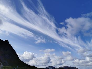 Low angle view of mountain against blue sky