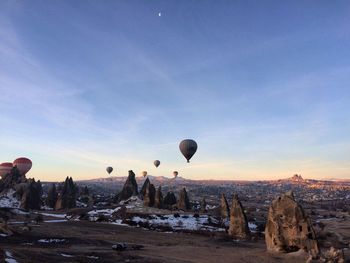 Hot air balloons flying against sky at cappadocia