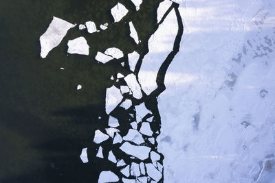 Shadow of man standing on snow