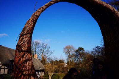 Low angle view of built structure against clear blue sky