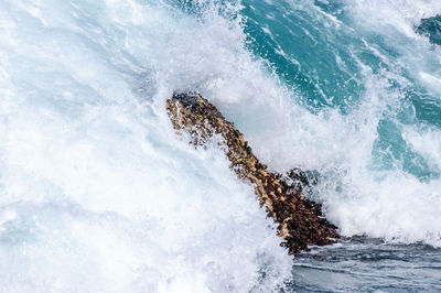 Waves splashing on rocks