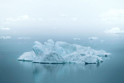 Scenic view of frozen sea against sky