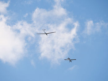 Low angle view of airplane in sky