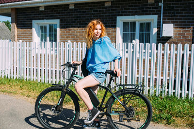 A young woman uses a modern electric bicycle for sports and outdoor recreation