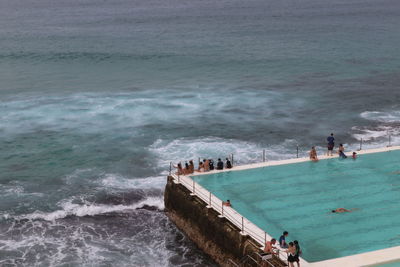 High angle view of people on swimming pool