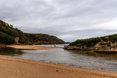 Scenic view of lonely beach a cloudy day of summer