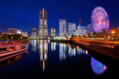 Illuminated buildings in city at night